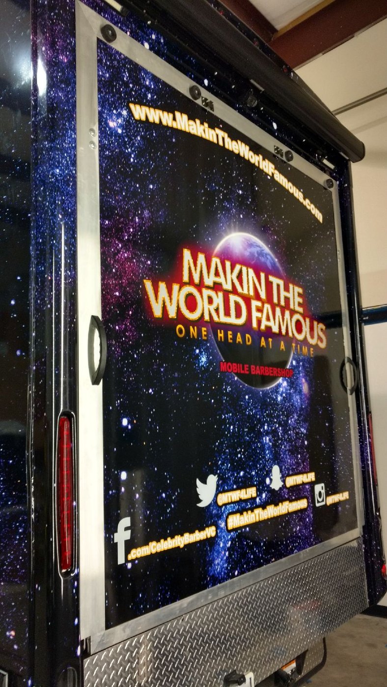 The mobile barbershop exterior screen and branded panel
